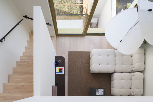 Architectural new-build townhouse with water views and multiple terraces.