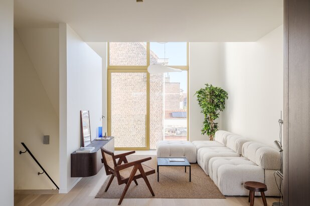 Architectural new-build townhouse with water views and multiple terraces.