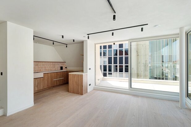 Superbe duplex/penthouse avec 2 chambres et finitions haut de gamme à distance de marche de la digue