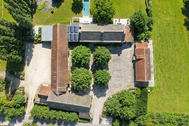 EXCEPTIONAL square farmhouse with numerous possibilities!