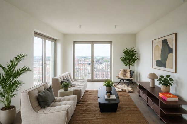 Penthouse met twee volwaardige slaapkamers en een uitzonderlijk terras met panoramisch zicht over Gent en zijn torens.