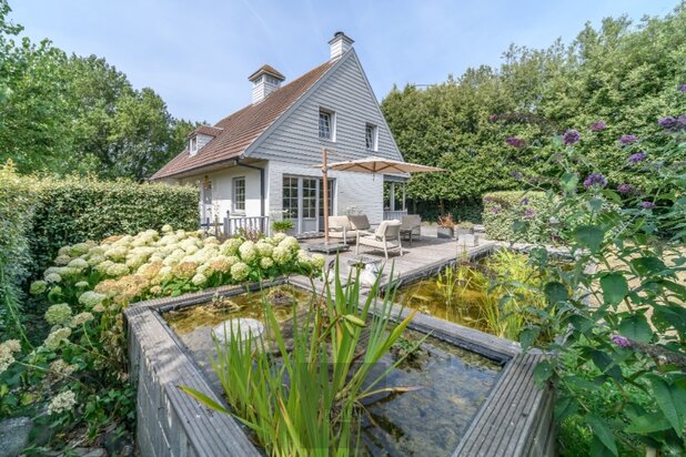 Charmante villa « Mi Casa » avec un jardin ensoleillé près de la mer.