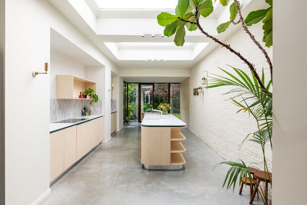 Elegant townhouse with a lush garden and multi-purpose room
