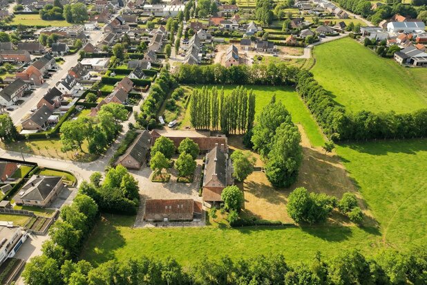 EXCEPTIONAL square farmhouse with numerous possibilities!